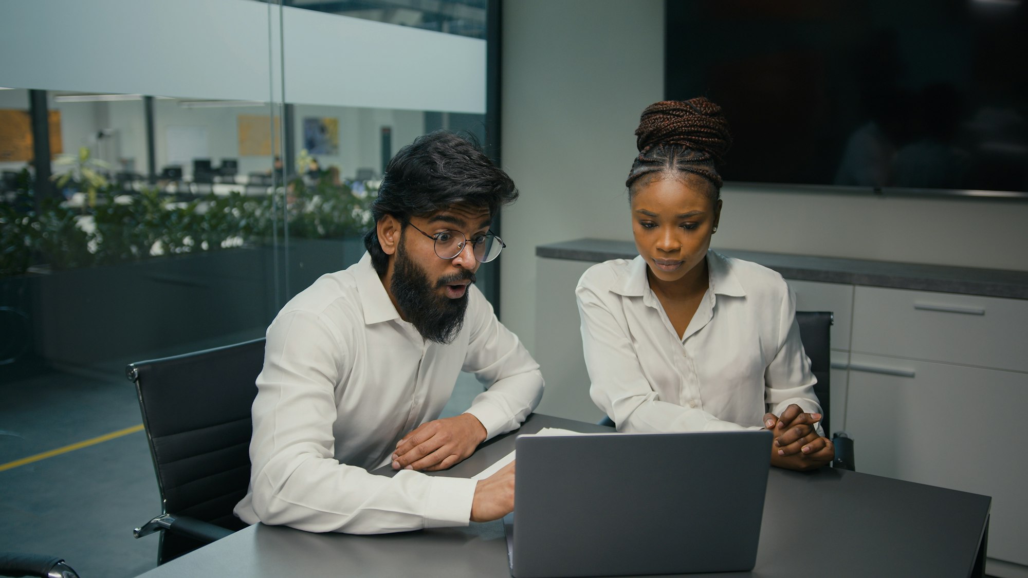 Business partners multiracial diverse company coworkers colleagues in office Indian man and African